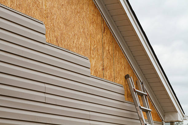 Professional Emergency Siding Repair technician working in Milton, IN
